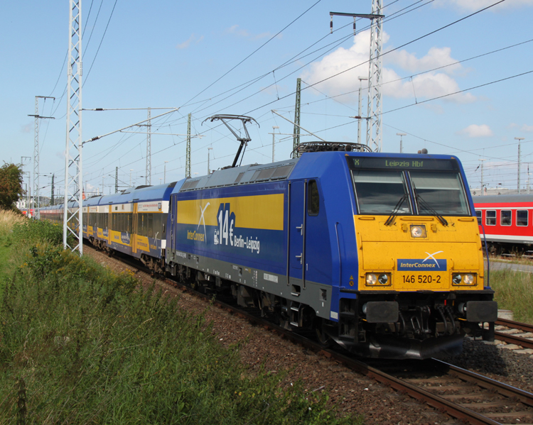 Die neue Werbelok beim InterConnex:146 520-2 mit X 68904 von Warnemnde nach Leipzig Hbf bei der Ausfahrt im Rostocker Hbf.02.09.2011 