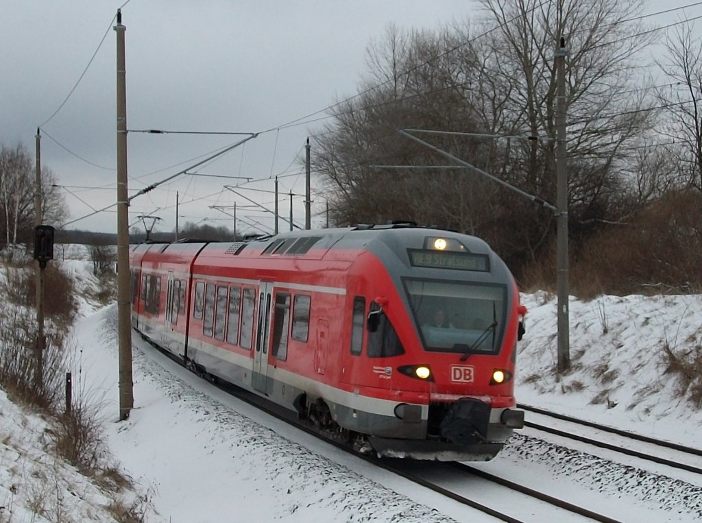 RE Binz-Stralsund am 15.Dezember 2010 vor Bergen/Rgen gefahren von 429 030.