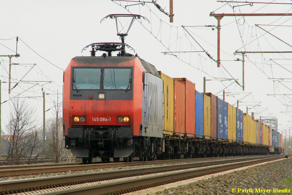 Metrans 145 088 mit Copntainerzug am 08.04.2015 in Dedensen-Gümmer auf dem Weg Richtung Wunstorf