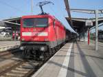 br-143-112-114 112 122-7 mit RE 33115 von Rostock Richtung Lutherstadt Wittenberg wartet auf die Ausfahrt im Rostocker Hbf,links steht 120 156-5(25.06.10)