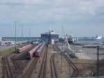 Blick auf dem Fährhafen mit abgestellten Dostos-und RE Wagen am 31.März 2016,auch zuerkennen die drei Stuttgarter 420er Triebwagen die am 24.März 2016 nach Mukran kamen.