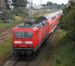 143 852-2 mit S1 von Warnemnde nach Rostock Hbf.bei der Ausfahrt im Bahnhof WRB.26.08.2011