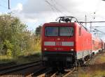Wieder ist eine 143er in Rostock ausgefallen:112 119-3 mit S2 Gstrow-Warnemnde bei der Einfahrt im Bahnhof Rostock-Bramow.12.10.2011