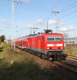 143 250-9 mit S2 von Warnemnde nach Gstrow kurz nach der Ausfahrt im Rostocker Hbf.21.10.2011