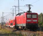 Nach dem 112 106-0 den RE 4357 von Rostock Hbf nach Rostock-Seehafen gebracht hatte ging es weiter in Richtung Berlin Sdkreuz.01.09.2012