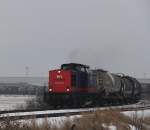202 264-8 mit Kesselzug von Stendell nach Rostock-Dierkow bei der Einfahrt in den lhafen Rostock.24.02.2013