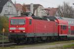 143 306-9 mit RE 18590(Berlin-Warnemnde)bei der Ausfahrt im Rostocker Hbf.15.11.2014