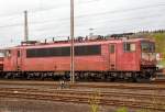   Noch in einem altem Farbkleid....Die 155 219-9 (91 80 6155 219-9 D-DB) der DB Schenker Rail Deutschland AG, ex DR 250 219-3, ist am 25.04.2015 in Kreuztal abgestellt.