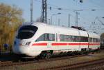 411 519-2 als ICE 1509 von Warnemnde nach Mnchen Hbf bei der Ausfahrt im Bahnhof Warnemnde.18.04.2015