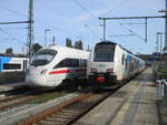 BB ICE-T 4011 092 als ICE 1711(Binz-Mnchen)und ODEG 4746 804,am 19.September 2020,im Bahnhof Bergen/Rgen.