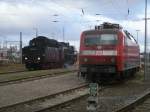 Rostock Hbf Seltener Gast im Bh Rostock war,am 17.Dezember 2011,die 03 1010 in den Betriebshof neben der 120 202 einfuhr. 
