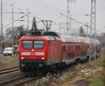 Rostock-Spezial 112 111-0 mit RE 4354 von Lutherstadt Wittenberg nach Rostock Hbf bei der Einfahrt um 11:23 Uhr im Rostocker Hbf.12.12.2011