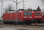 Rostock-Spezial die seltenen G�ste werde immer besser:diesmal war 185 011-4 stand im BW Rostock Hbf abgestellt neben an stand 112 118 keiner wollte mit denen auf die Strecke raus.08.01.2012