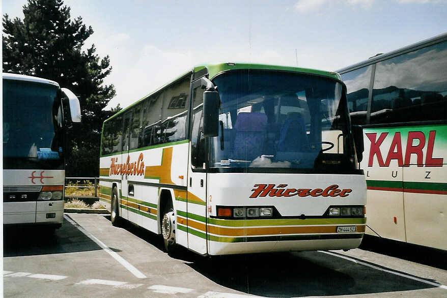 (061'319) - Hrzeler, Dietikon - Nr. 2/ZH 444'523 - Neoplan am 7. Juli 2003 beim Bahnhof Interlaken West