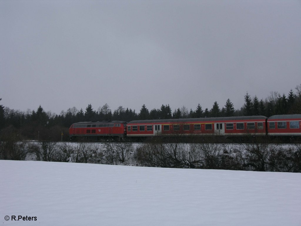 Eine 218 schiebt kurz hinter Memmingen ein RE Mnchen HBF. 24.02.09