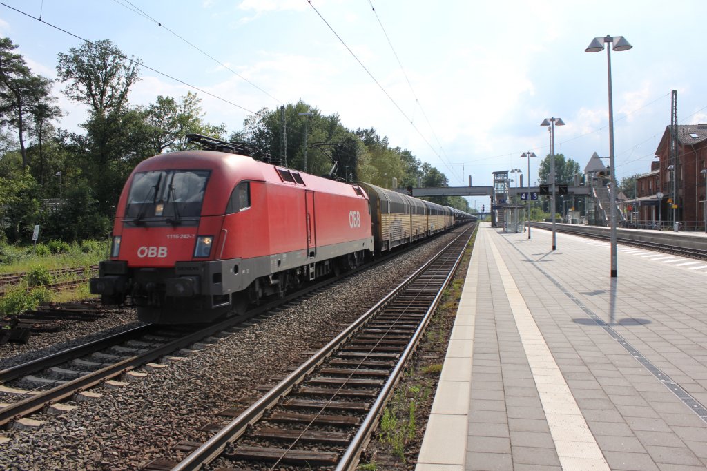 BB 1116 242-7 mit ASR Autowagen durchfhrt den Bahnhof Tostedt am 27.07.2011