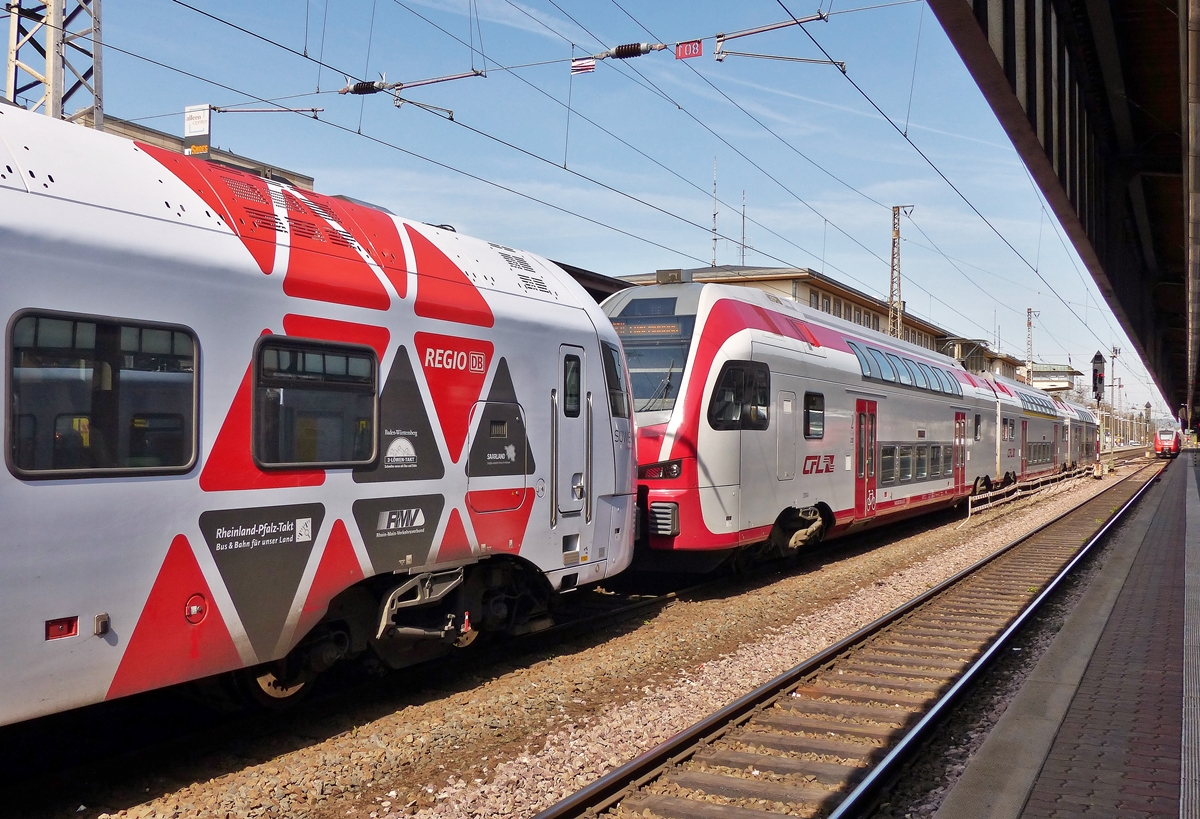 . Der 5-teilige FLIRT der DB Regio und der KISS 2306 der CFL fahren zusammen gekoppelt am 10.04.2015 in den Trierer Hauptbahnhof ein. Sie kommen aus Koblenz und werden in Trier getrennt. Der SÜWEX fährt weiter nach Mannheim, während der KISS nach Luxembourg fährt. (Jeanny)