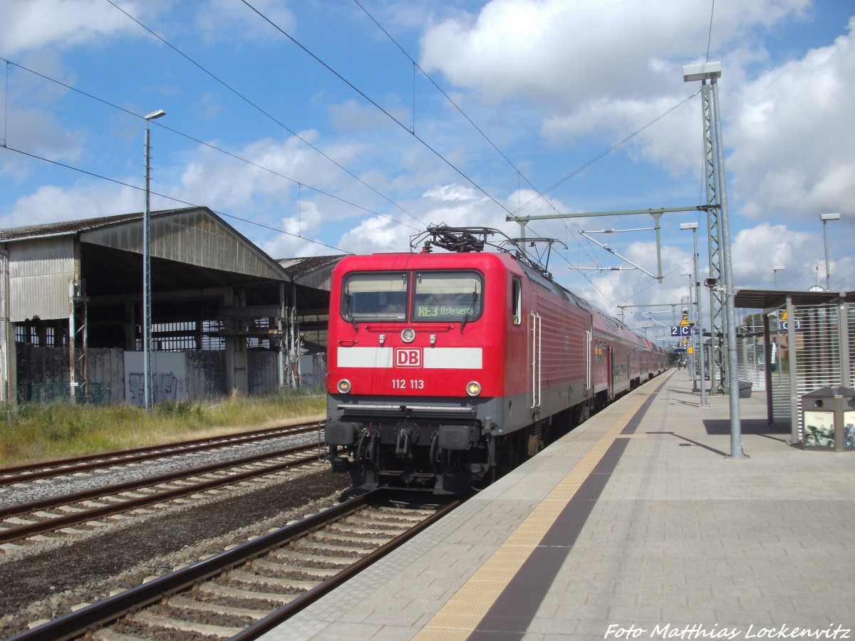 112 113 als RE3 mit ziel Elsterwerda im Bahnhof Z�ssow am 15.7.14
