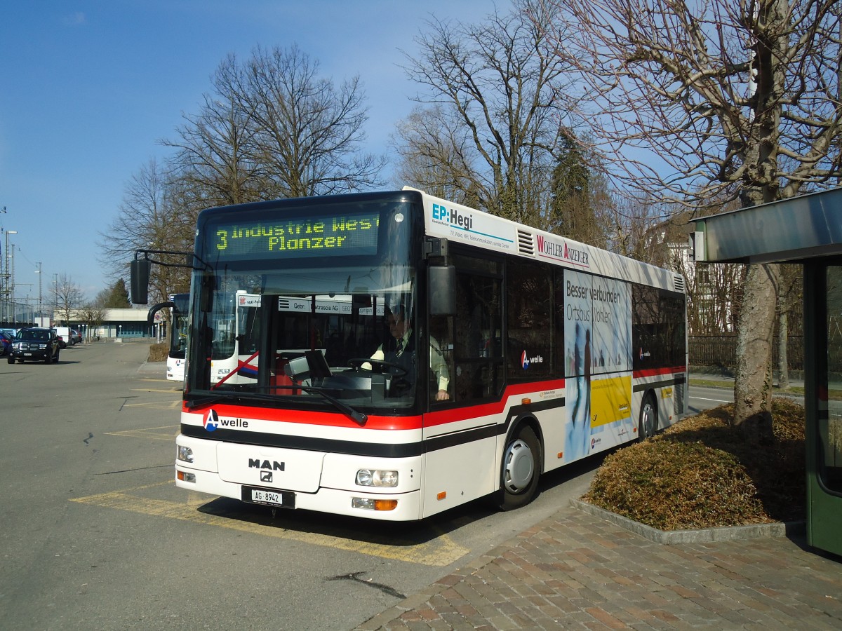 (138'058) - Geissmann, H�gglingen - AG 8942 - MAN am 6. M�rz 2012 beim Bahnhof Wohlen