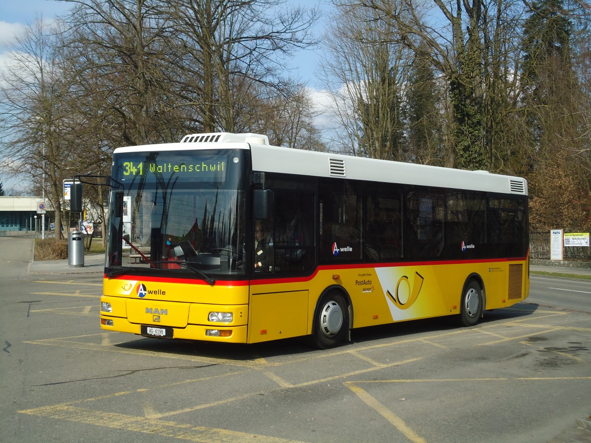 (138'062) - Geissmann, H�gglingen - AG 6198 - MAN am 6. M�rz 2012 beim Bahnhof Wohlen