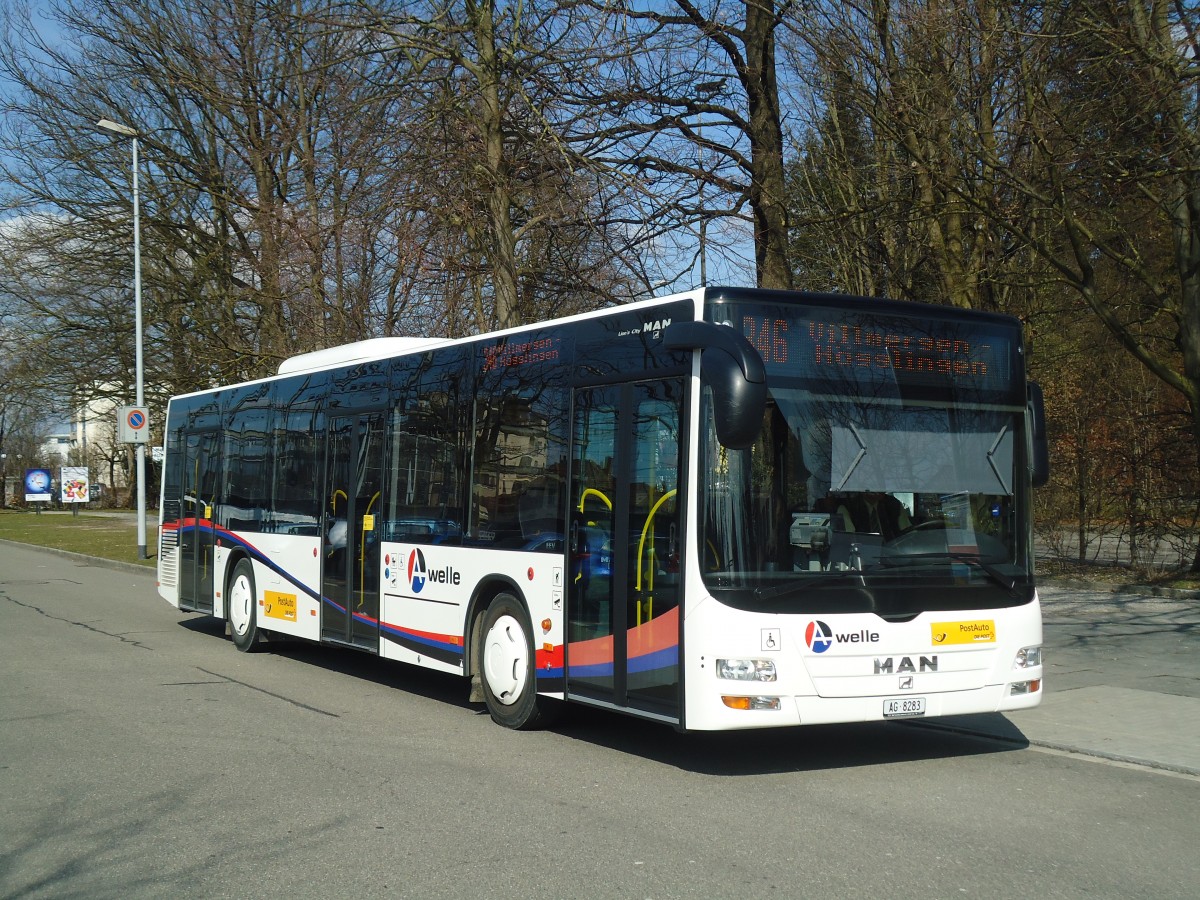 (138'068) - Geissmann, H�gglingen - AG 8283 - MAN am 6. M�rz 2012 beim Bahnhof Wohlen