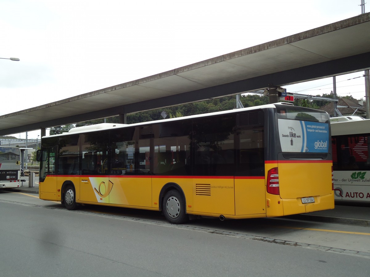 (144'932) - H�fliger, Sursee - Nr. 4/LU 197'104 - Mercedes (ex PostAuto Nordschweiz Nr. 4) am 10. Juni 2013 beim Bahnhof Sursee