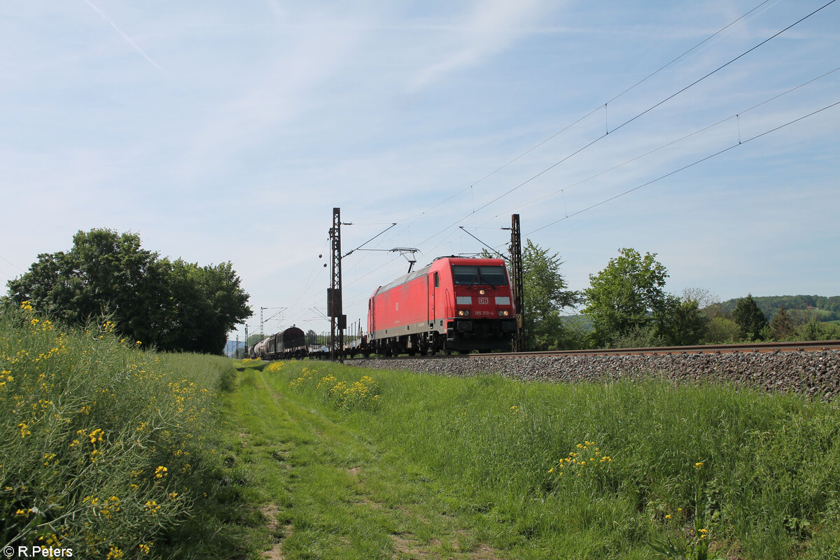 185 313-4 mit einem gemischten Güterzug bei Himmelstadt gen Norden. 11.05.24