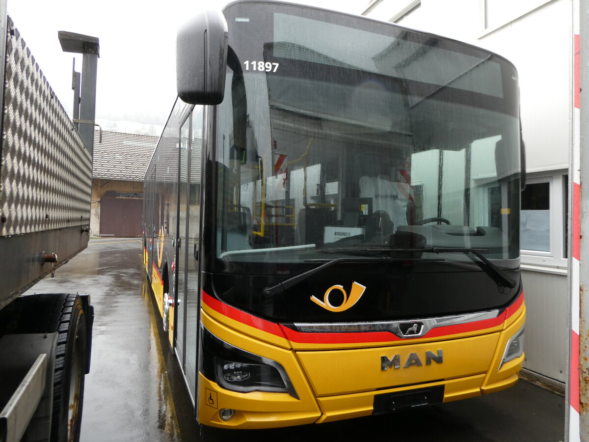 (243'706) - PostAuto Ostschweiz - PID 11'897 - MAN am 10. Dezember 2022 in Schmerikon, Thomann