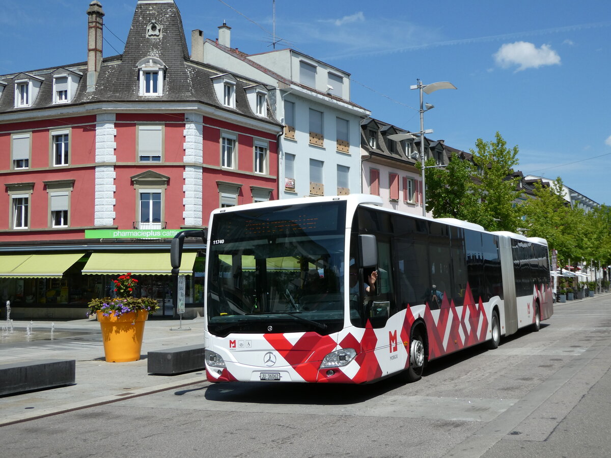 (252'446) - CarPostal Ouest - JU 36'062/PID 11'740 - Mercedes am 7. Juli 2023 beim Bahnhof Delmont