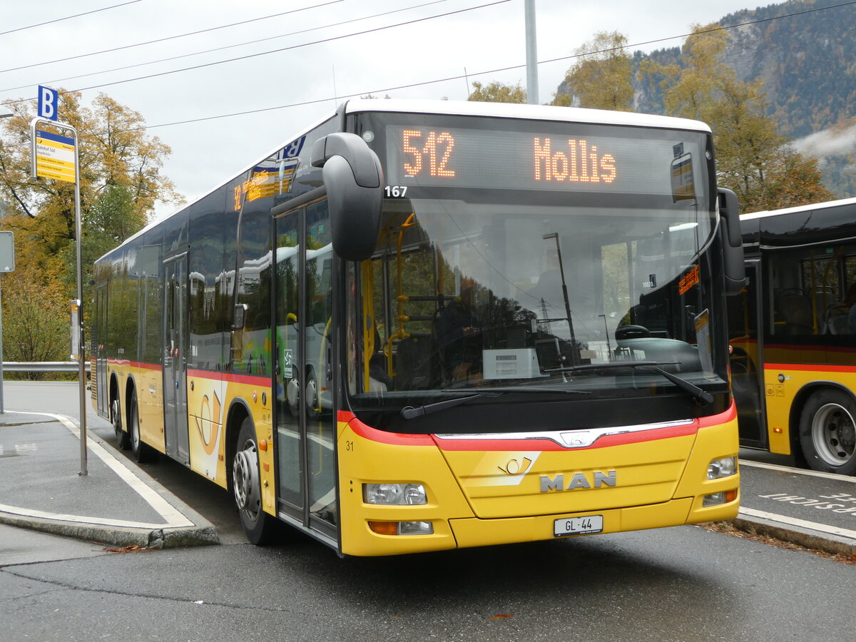 (256'564) - Niederer, Filzbach - Nr. 31/GL 44/PID 10'167 - MAN (ex Schwizer, Goldach; ex Casutt, Gossau) am 31. Oktober 2023 beim Bahnhof Ziegelbr�cke