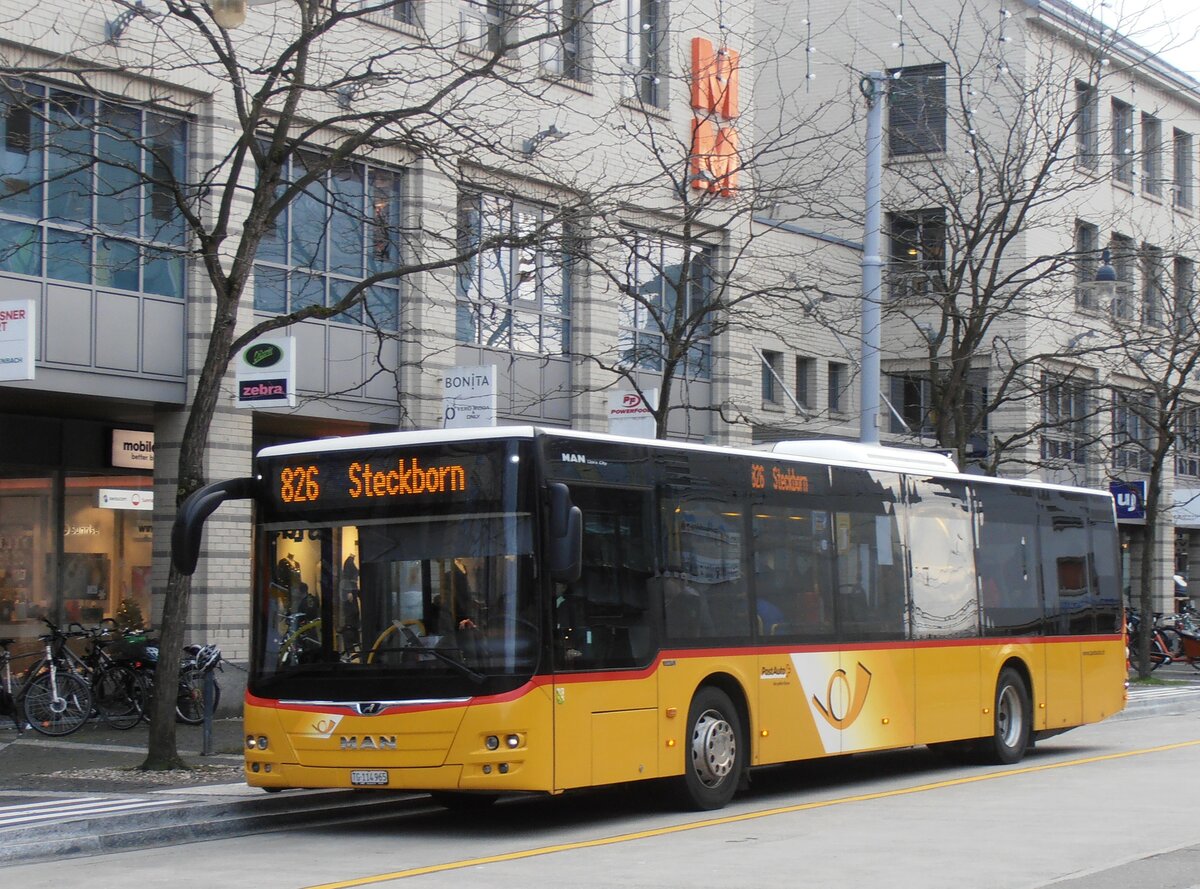 (257'673) - PostAuto Ostschweiz - TG 114'965/PID 11'126 - MAN am 15. Dezember 2023 beim Bahnhof Frauenfeld