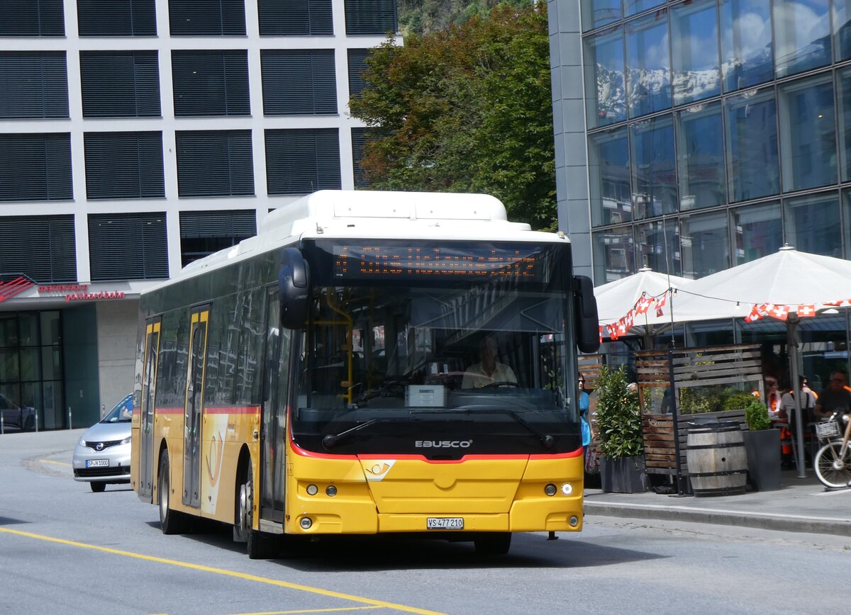 (263'987) - PostAuto Wallis - VS 477'210/PID 10'838 - eEbusco am 24. Juni 2024 beim Bahnhof Brig