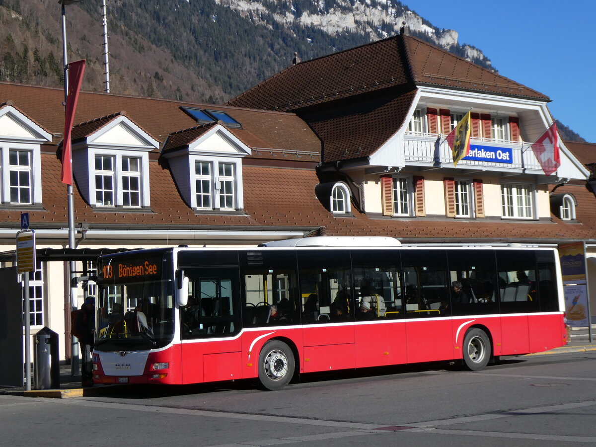 (269'899) - PostAuto Bern - BE 403'166/PID 12'336 - MAN (ex ex Dr. Richard, A-Wien Nr. 1411) am 16. Dezember 2024 beim Bahnhof Interlaken Ost