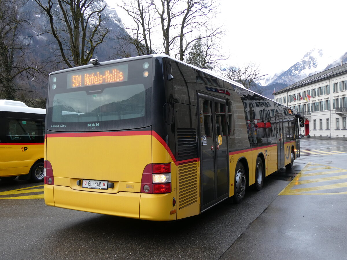 (271'863) - Niederer, Filzbach - GL 348/PID 5663 - MAN (ex D�nser, Trimmis) am 12. Februar 2025 beim Bahnhof Glarus