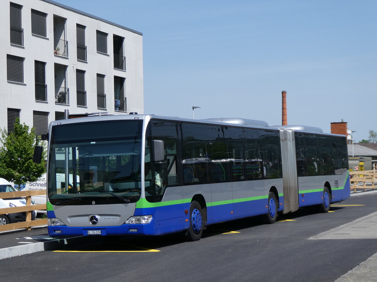 (274'446) - PostAuto Nordschweiz - BL 154'229/PID 12'420 - Mercedes (ex TPL Lugano Nr. 404) am 2. Mai 2025 beim Bahnhof Aesch