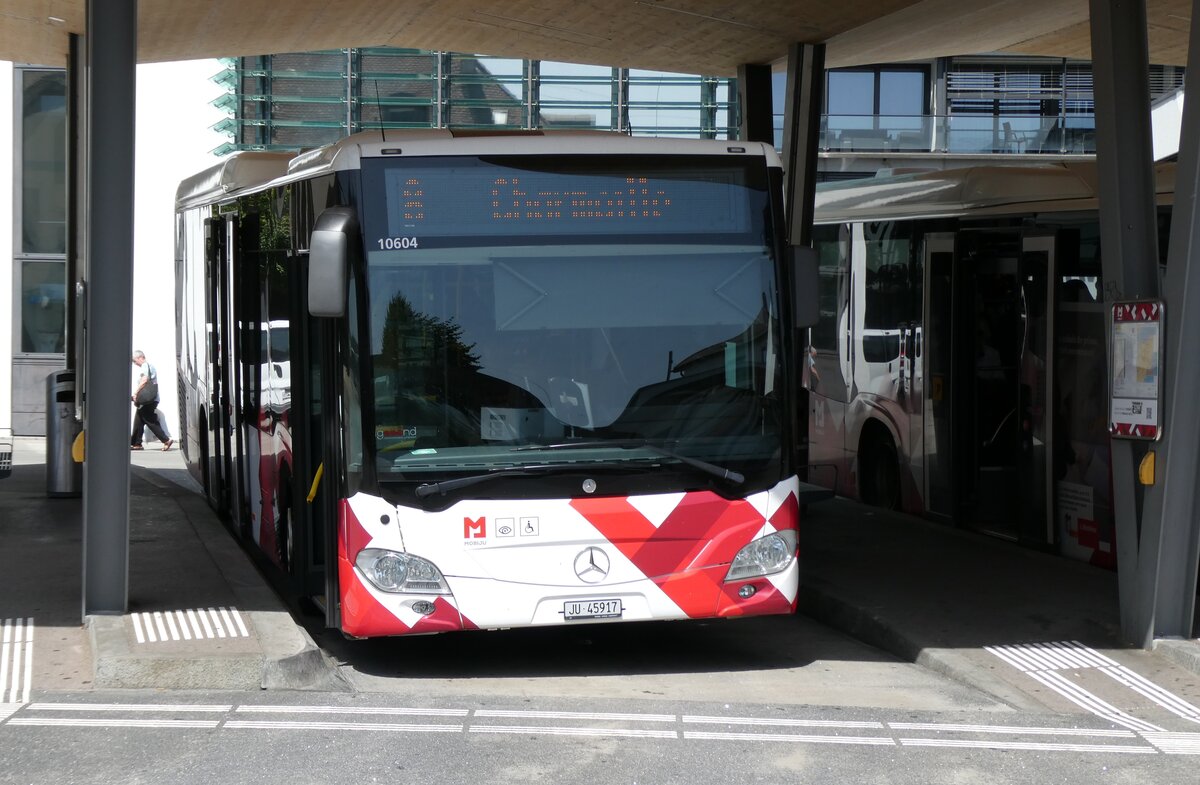 (278'834) - CarPostal Ouest - JU 45'917/PID 10'604 - Mercedes (ex JU 63'349; ex VD 464'947) am 14. August 2025 beim Bahnhof Del�mont