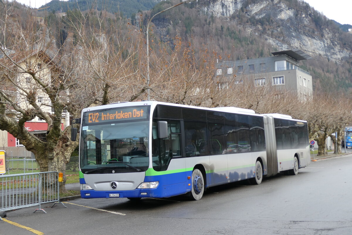 (283'287) - PostAut Nordschweiz - BL 154'229/PID 12'420 - Mercedes (ex TPL Lugano Nr. 404) am 19. Dezember 2025 beim Bahnhof Meiringen