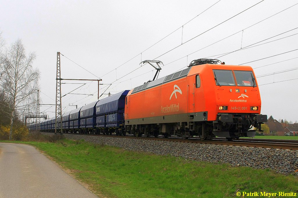 Arcelor Mittal 145-CL-001 mit Kohlewagenzug am 08.04.2015 in Dedensen-Gümmer auf dem Weg Richtung Hannover