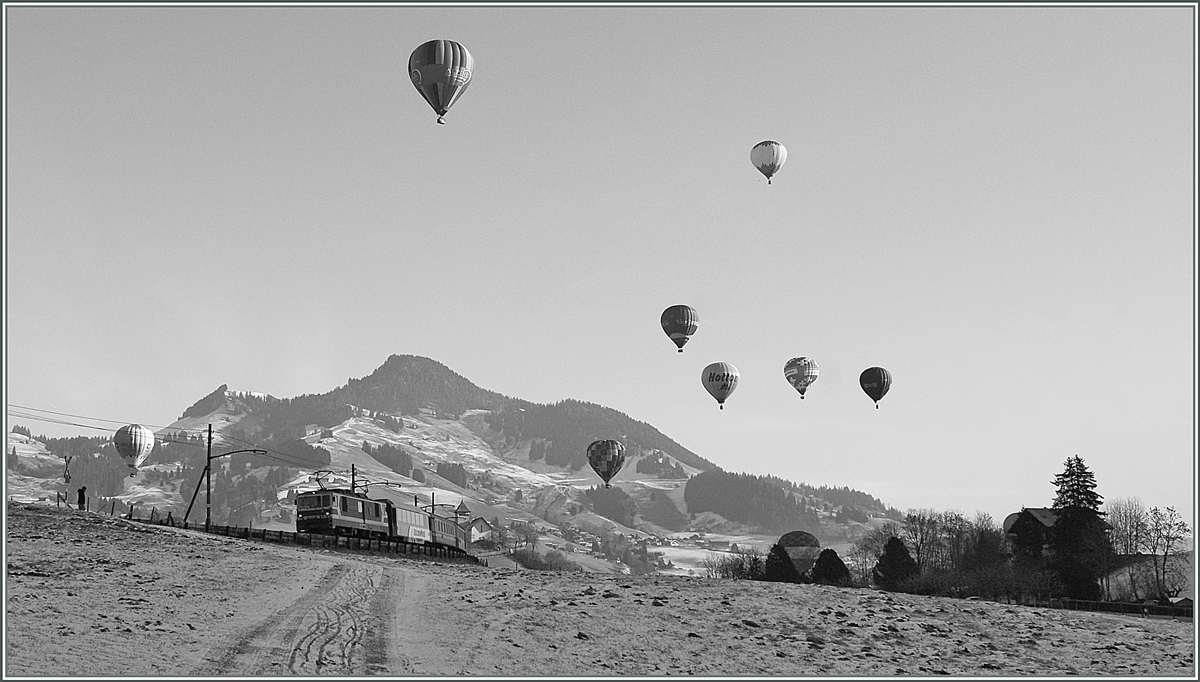 Ein MOB GDe 4/4 (Serie 6000) ist währnd des Ballons Festivals bei Château d'Oex auf dem Weg nach Montreux. 

23. Jan. 2011