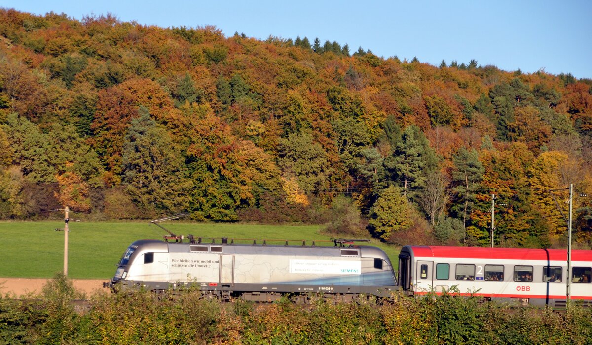 ÖBB 1116 038-9 mit Siemens-Werbung und ÖBB EC bei Urspring am 12.10.2010.