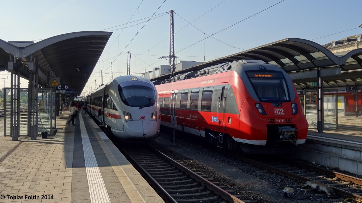 Zugkreuzung in Bamberg: Rechts am Gleis 5 steht die S-Bahn Richtung Nürnberg und links der ICE in Richtung Berlin.
Aufgenommen im April 2014.