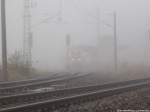 im Nebel sieht man 711 116-4 am Bahnhof Stralsund-R�gendamm Stehen am 14.11.13