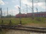 BR 143 als S2 unterwegs nach G�strow bei der Ausfahrt aus Rostock Hbf am 22.6.13
