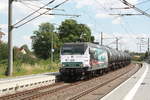 145 023 (145 083) der PRESS mit einem Kesselzug bei der durchfahrt in Z�beritz am 14.7.20