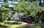 99 1782-4 rast mit P 105 durch den Wald vor Sellin West am 03.08.2015