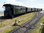 Traditionszug mit 99 72xx in der Brocken-Station und Weichenlaterne der Handweiche am 27.07.2019.
