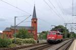 Dunkle Wolken ber 110 406-6 als  SIE  am 16.09.2013 im Bahnhof Neumnster auf Rangierfahrt ist, um Ihren Zug aus der Abstellung zu holen.