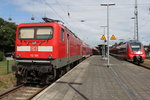112 185 mit RE 18491(Warnemnde-Berlin Hbf)abgestellt im Bahnhof Warnemnde.26.06.2016