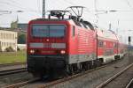 Die ex Rostocker 143 843-1 mit Warnemnde-Express 18591 von Warnemnde nach Berlin Hbf(tief)als DB-Dienstfahrt im Rostocker Hbf.11.10.2014