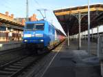 PRESS 145 030 durch fuhr am 28.12.2011 dem Bahnhof in Stendal mit einem Hackschnitzelzug in Richtung Wittenberge.